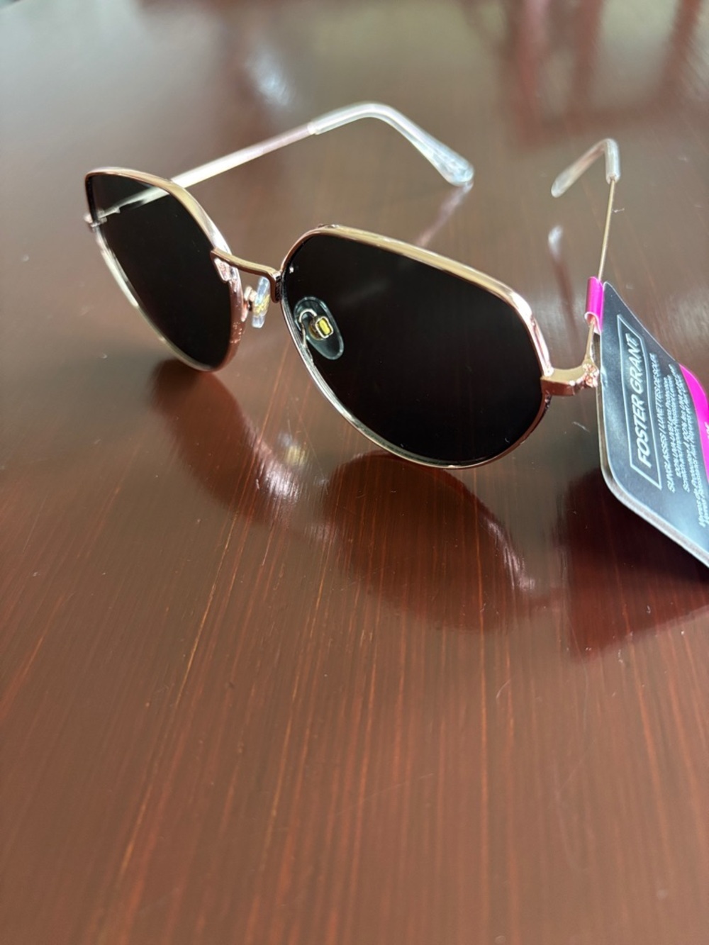 Foster Grant 100% UVA-UVB protect,gold round geometric frame, black lens